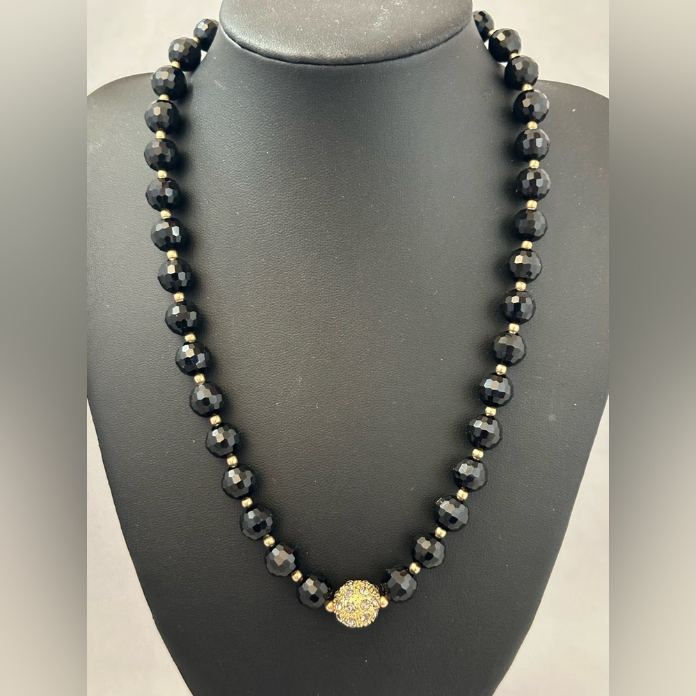 Monet black faceted glass bead necklace with gold tone rhinestone studded bead